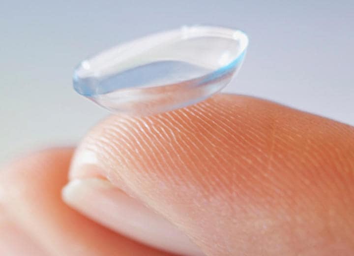 Contact lens on finger